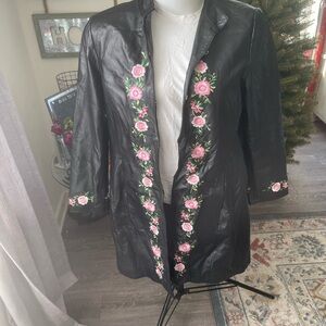 Vintage leather jacket. 
Black leather with pink flowers embroidery…